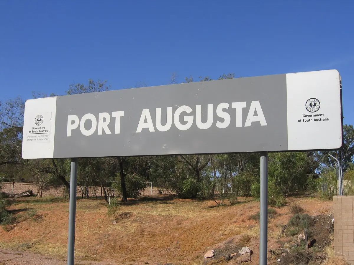 The Port Augusta station sign under a blue sky